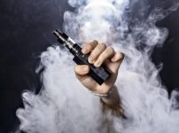 a man holding an e cigarette thumb 202x150 - 【まとめ】VAPE始めた頃の自分に言ってあげたい言葉【オーセン/クローン/海外購入の嘆き】